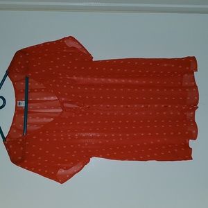 Red blouse with white dots